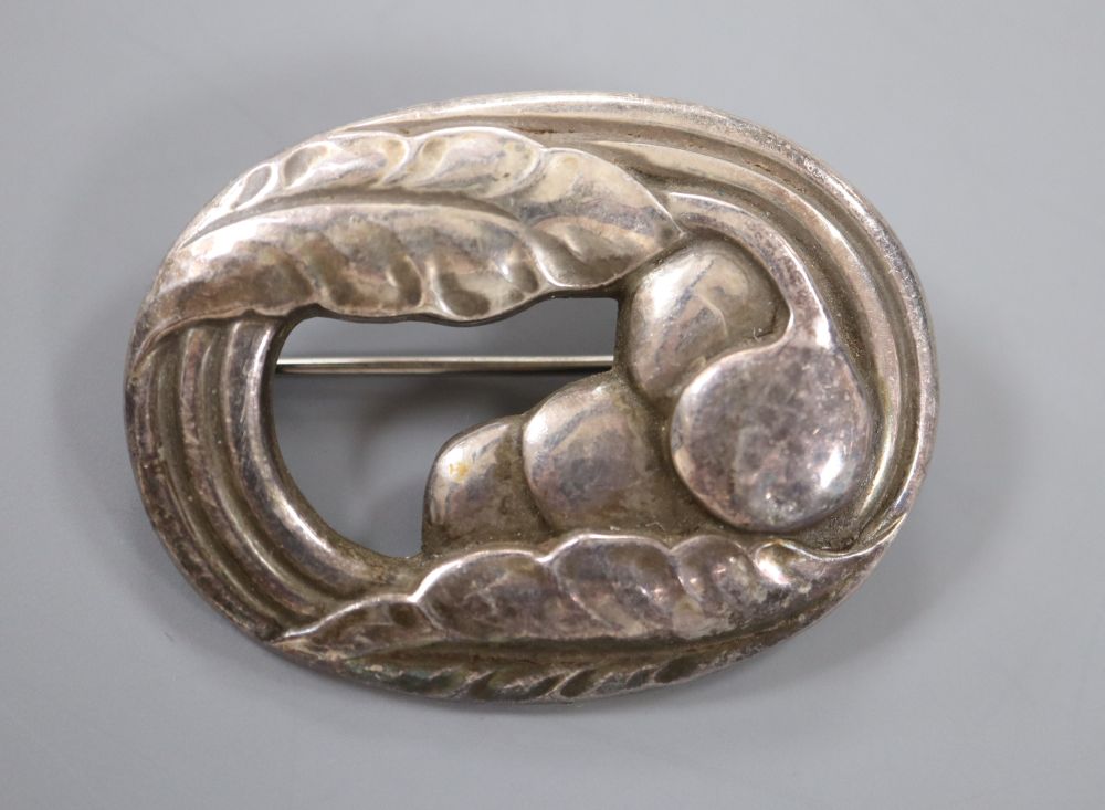 An early 1950s Georg Jensen silver leaf and berry oval brooch, design no. 18, 45mm, 11.1 grams.